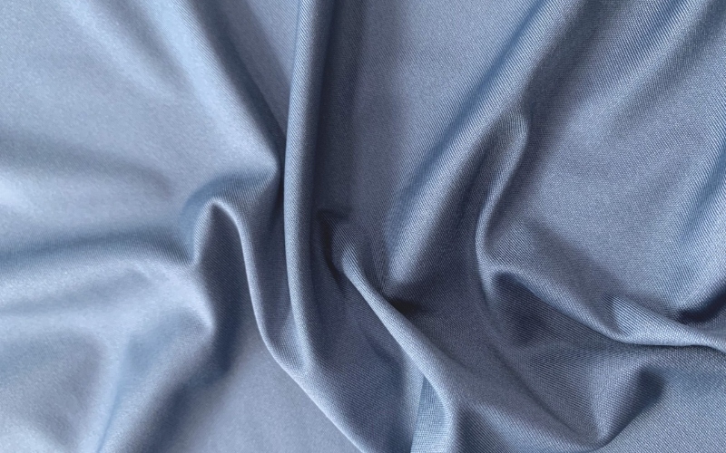 Vải Nylon pha Spandex có cấu trúc sợi tổng hợp bền chắc giúp hạn chế tia UV