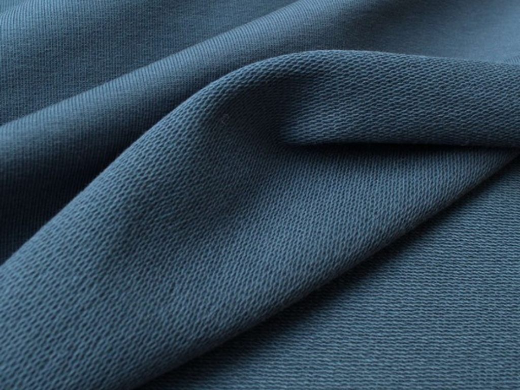 Một bề mặt của vải thun da cá có các vòng xù lên giống như vảy cá