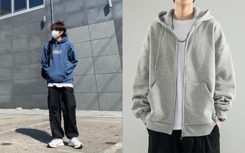 Phần mũ áo hoodie được kéo ra ngoài cổ áo khoác tạo nên điểm nhấn