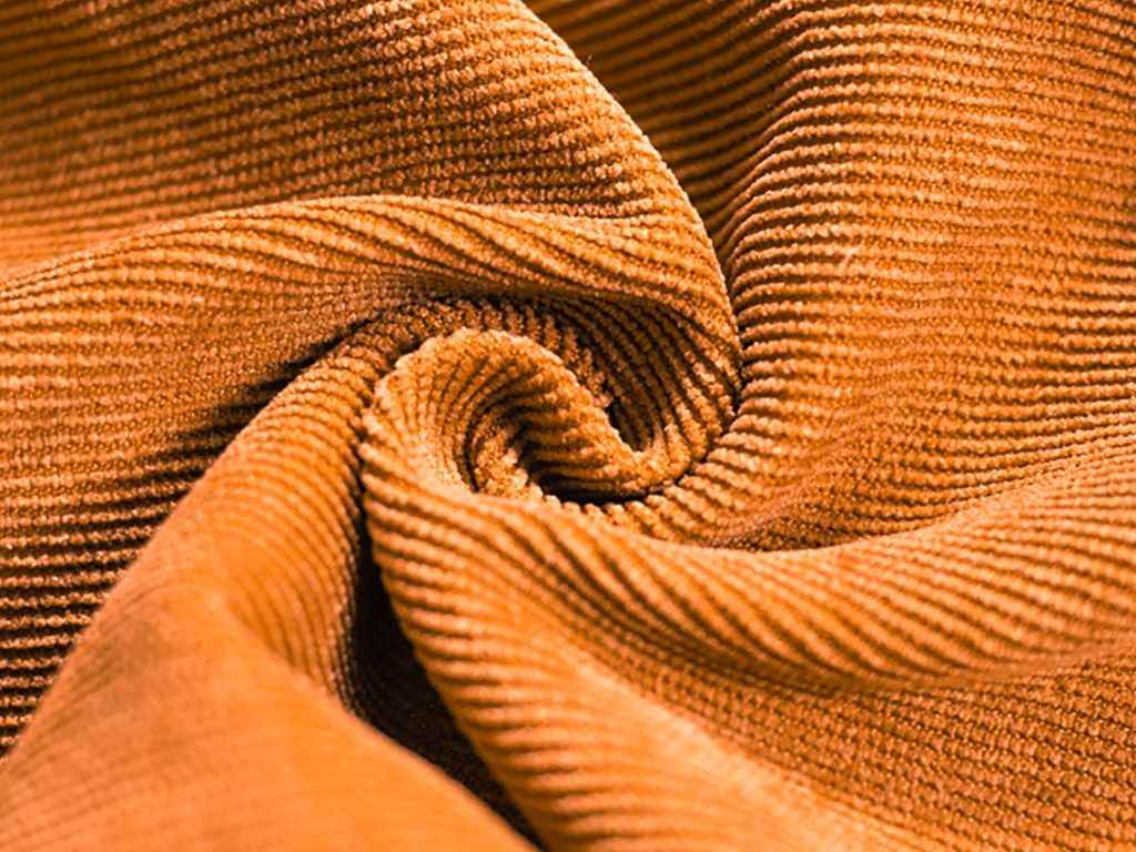 Materials such as ribbed knit create an interesting visual effect