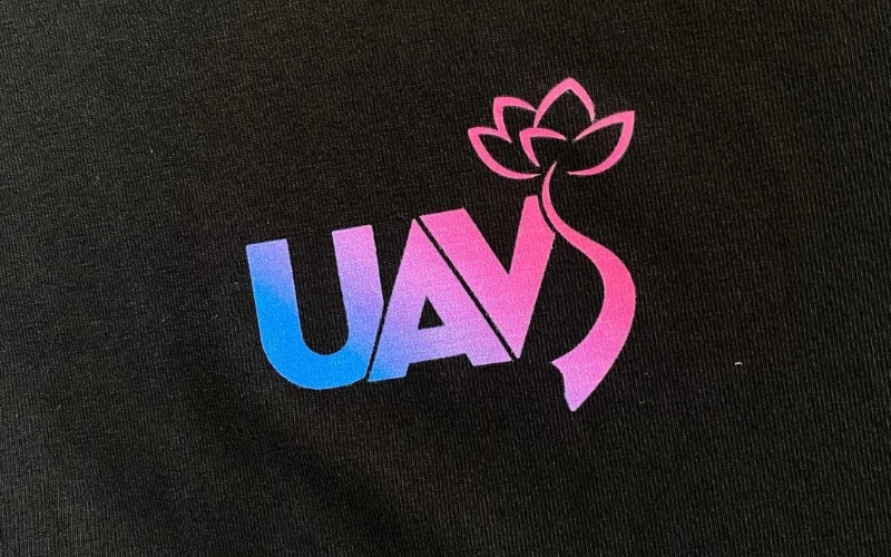 The UAVS logo print is crisp and prominent on the black fabric background