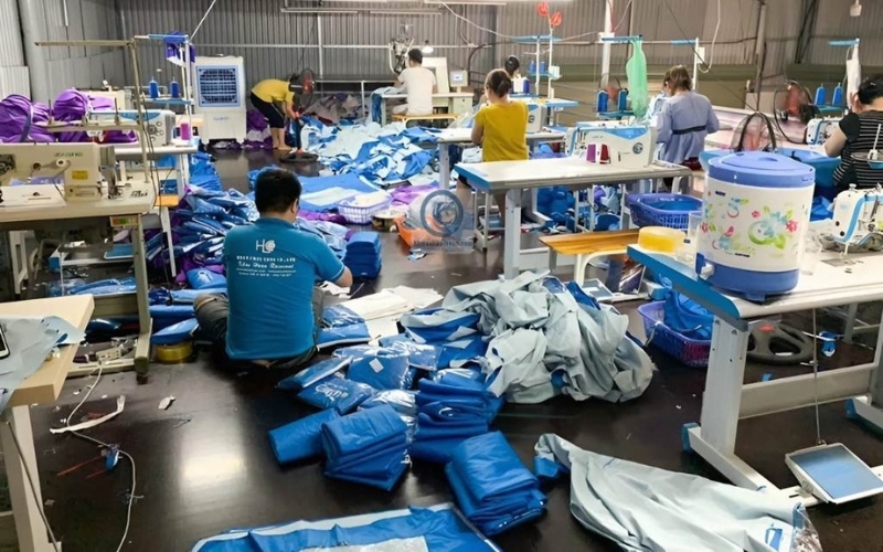 Raincoats are neatly folded after passing quality inspection